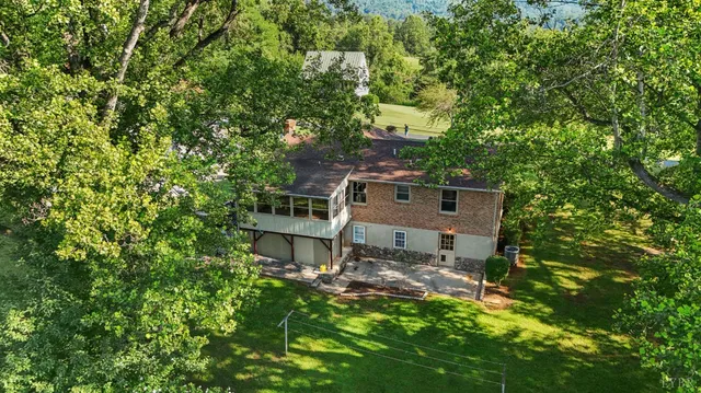 a front view of a house with outdoor seating