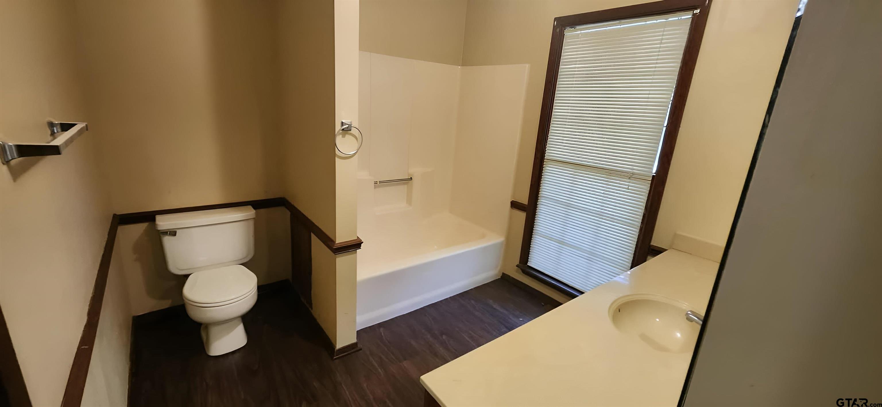 14141 County Road 1237 Tyler, TX 75703 - Photo 11 of 19 a bathroom with toilet and a sink