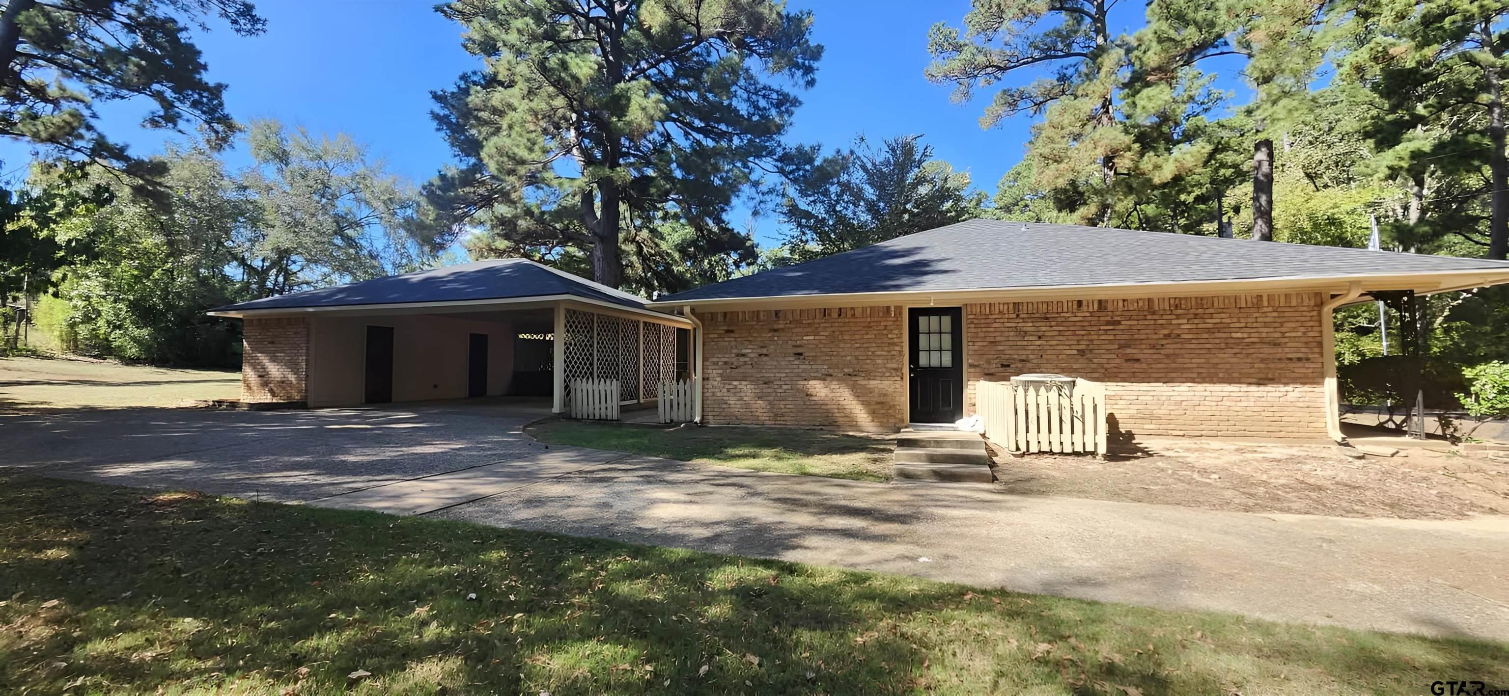 14141 County Road 1237 Tyler, TX 75703 - Photo 11 of 15 a view of a house with backyard and a tree