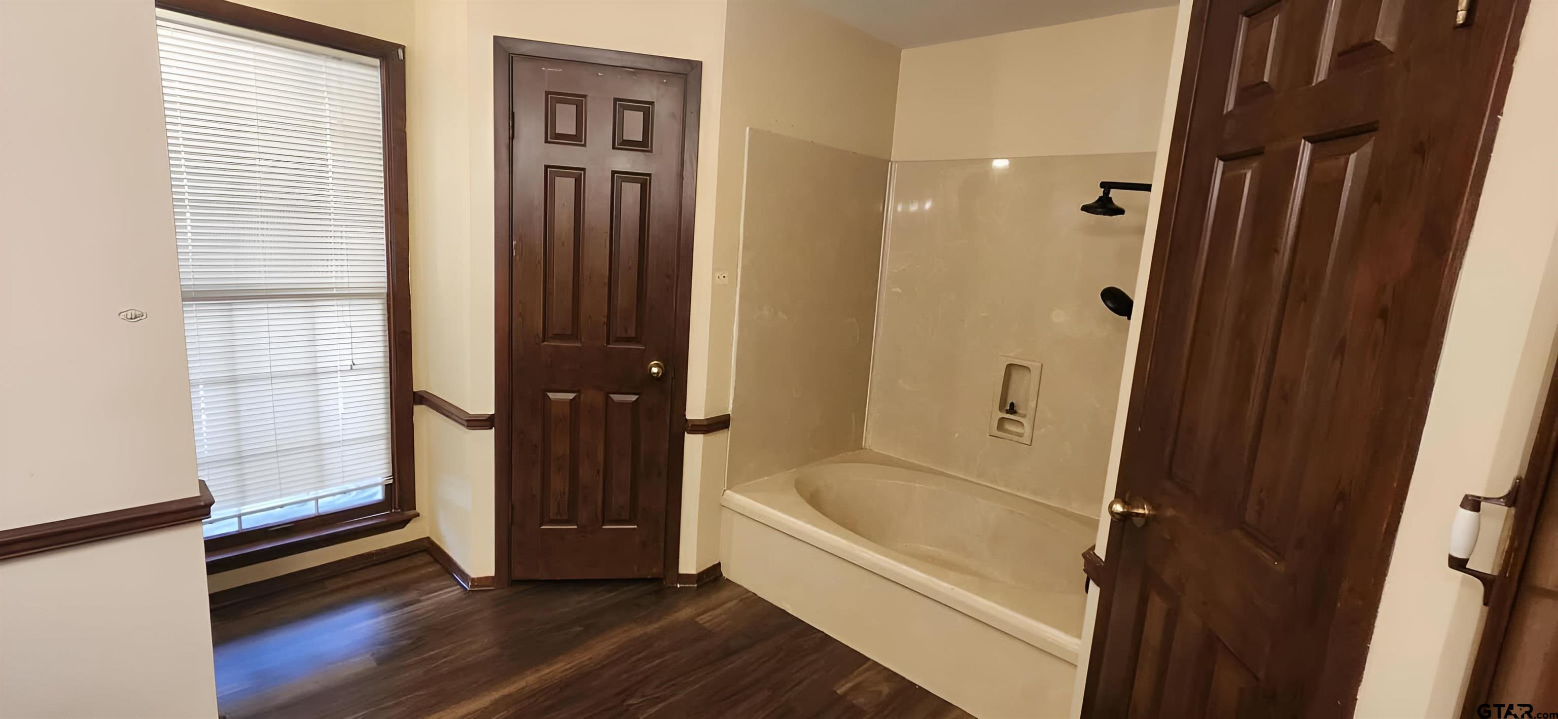 14141 County Road 1237 Tyler, TX 75703 - Photo 12 of 19 a bathroom with a tub and shower