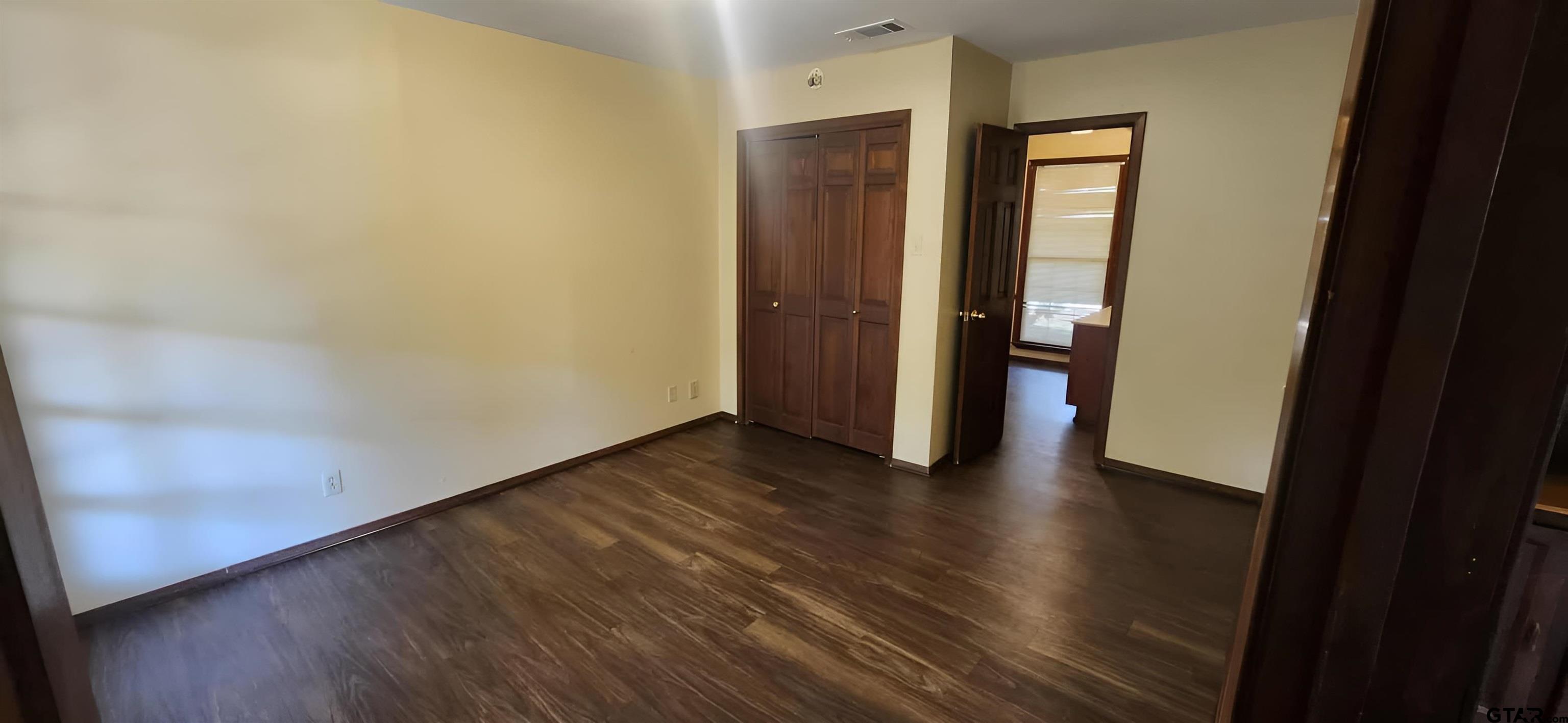 14141 County Road 1237 Tyler, TX 75703 - Photo 7 of 15 a view of a hallway with wooden floor