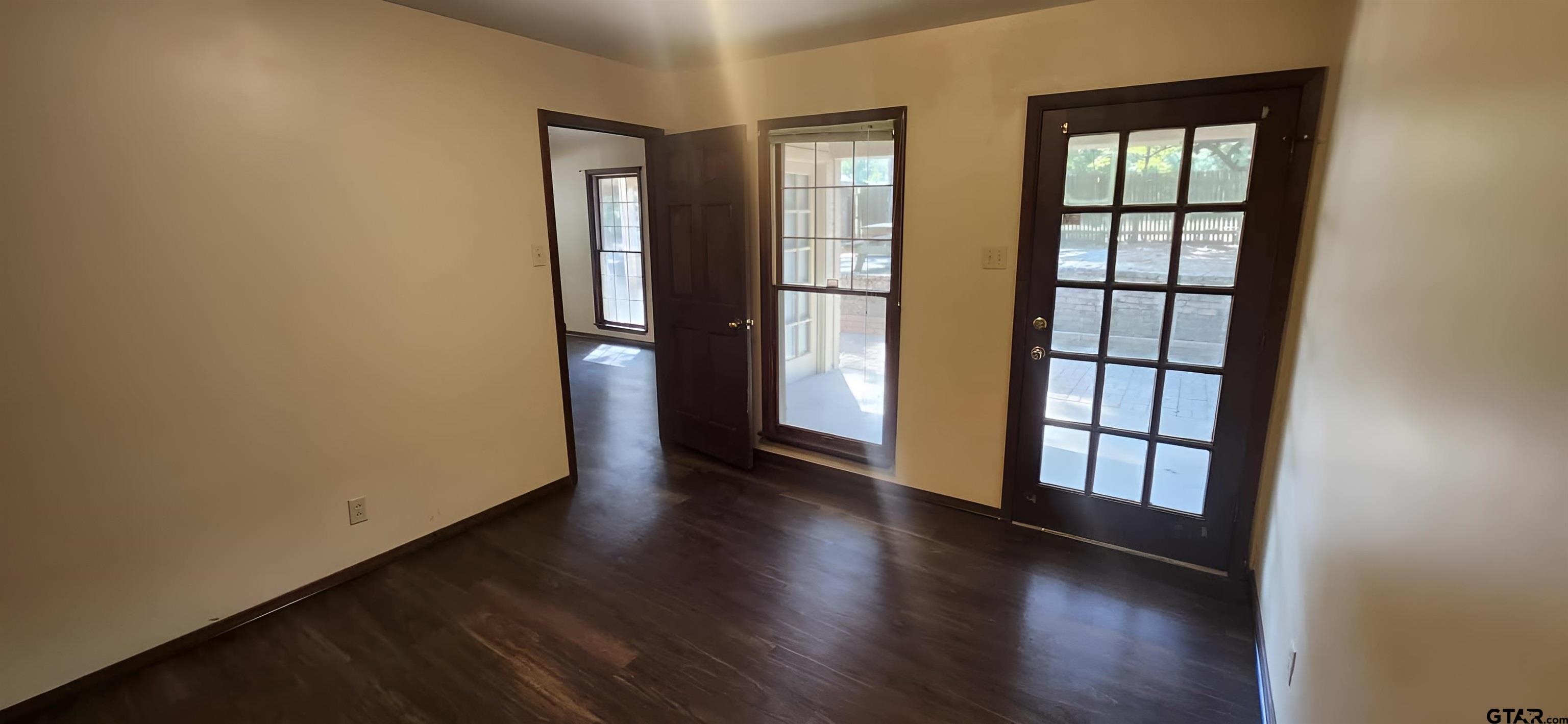 14141 County Road 1237 Tyler, TX 75703 - Photo 8 of 19 wooden floor in an empty room with a window