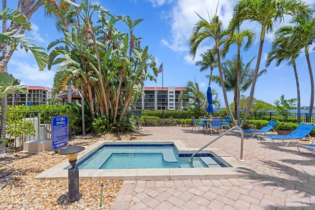 a view of swimming pool with outdoor seating and plants