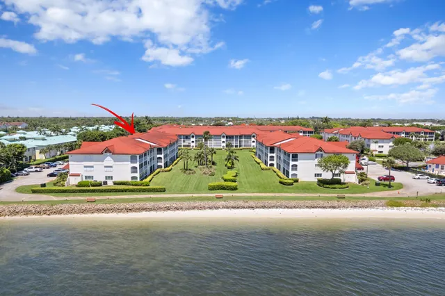 an aerial view of multiple house with parking space