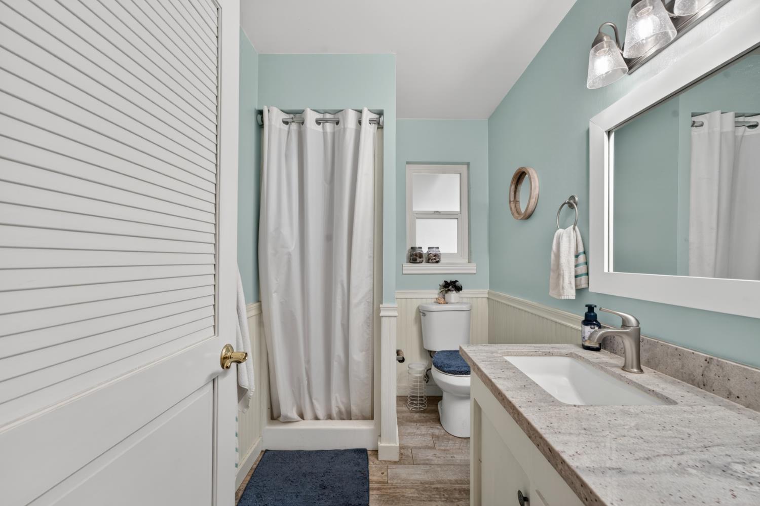 1880 Magnolia Street Gridley, CA 95948 - Photo 48 of 95 a bathroom with a granite countertop sink and a mirror