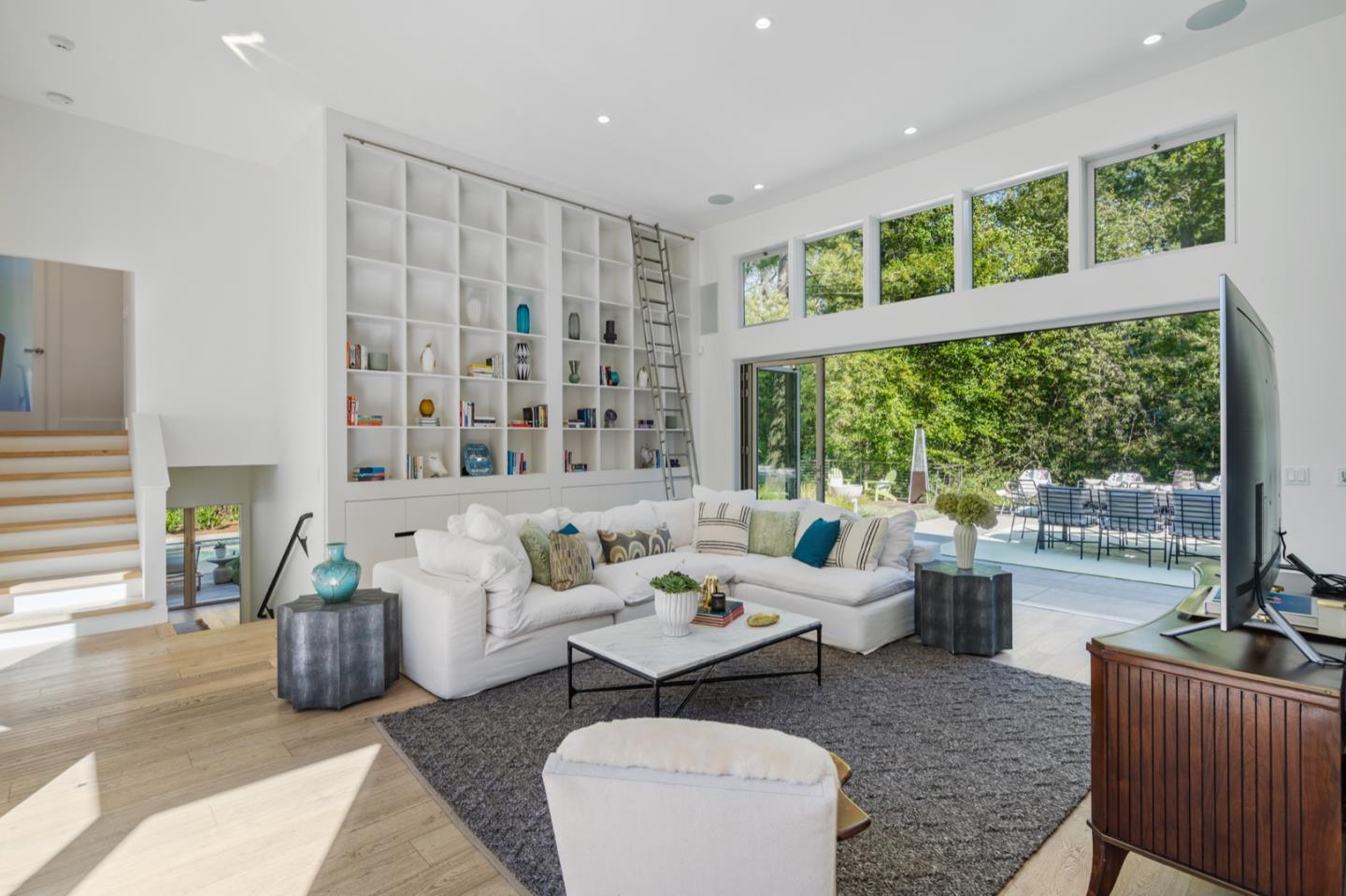 135 Willowbrook Drive Portola Valley, CA 94028 - Photo 17 of 50 a living room with furniture and a large window
