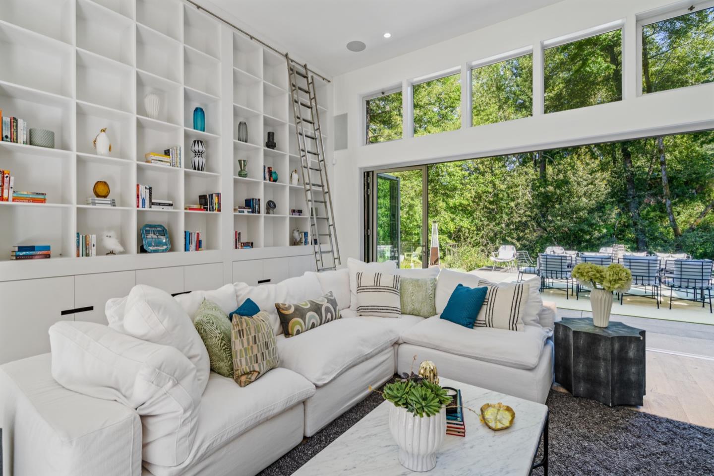 135 Willowbrook Drive Portola Valley, CA 94028 - Photo 18 of 50 a living room with furniture and a large window
