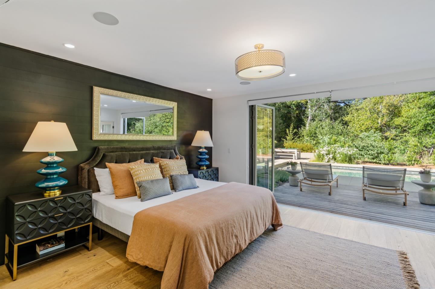 135 Willowbrook Drive Portola Valley, CA 94028 - Photo 23 of 50 a bedroom with a bed and a large window