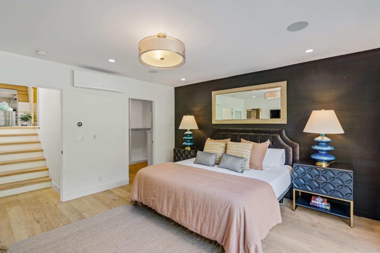 135 Willowbrook Drive Portola Valley, CA 94028 - Photo 24 of 50 a bedroom with a bed and a lamp