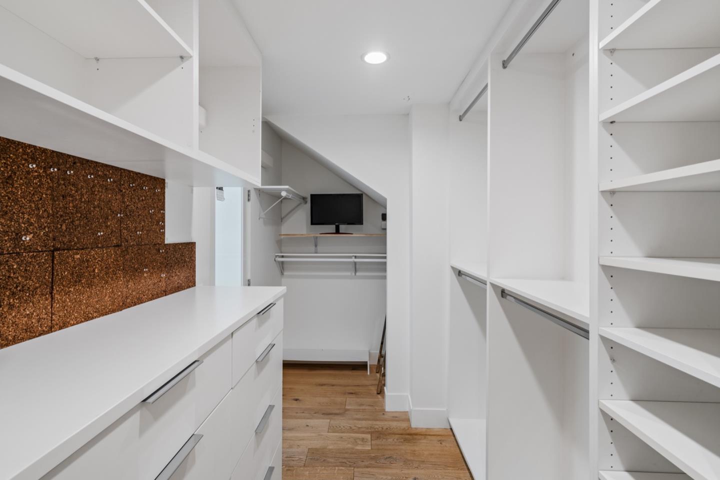 135 Willowbrook Drive Portola Valley, CA 94028 - Photo 29 of 50 a kitchen with white cabinets and white appliances