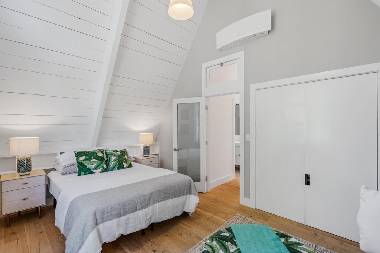 135 Willowbrook Drive Portola Valley, CA 94028 - Photo 33 of 50 a bedroom with a bed and wooden floor