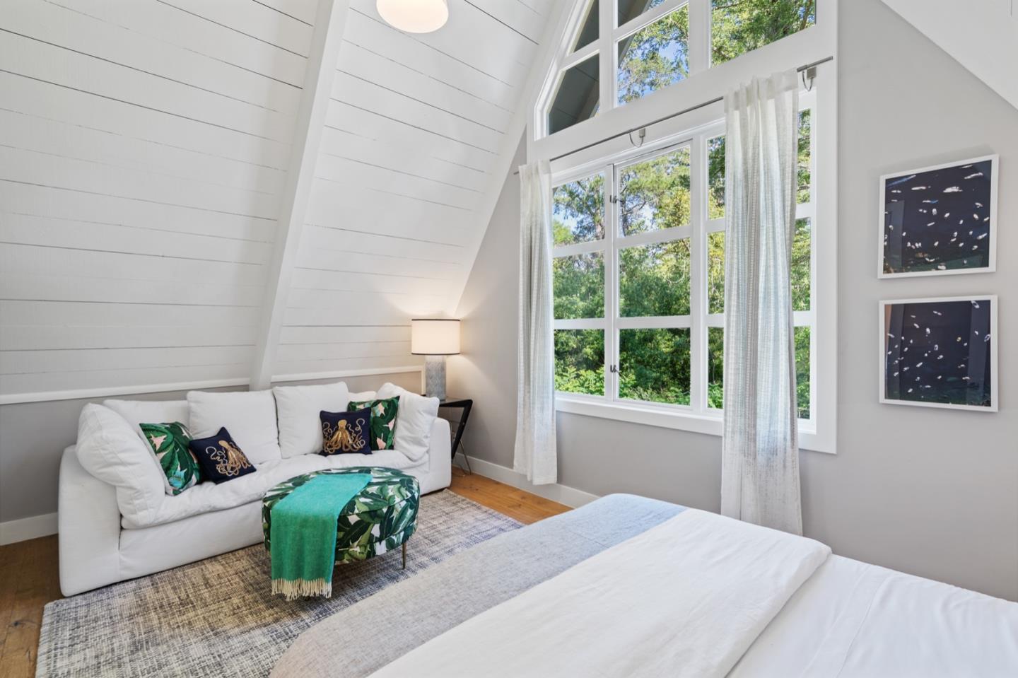 135 Willowbrook Drive Portola Valley, CA 94028 - Photo 34 of 50 a bedroom with furniture and a large window