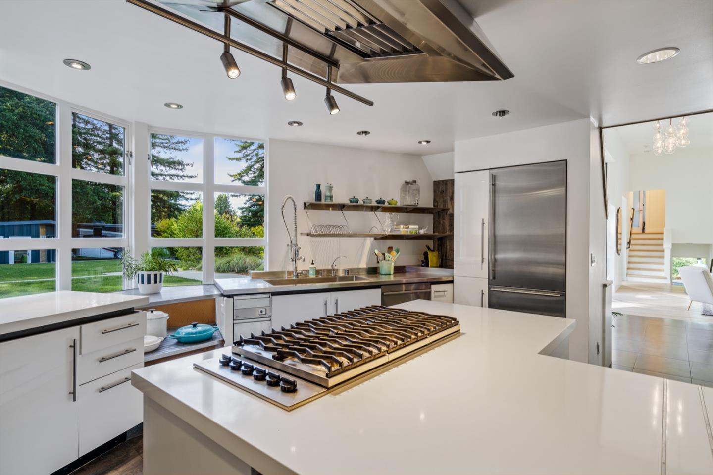 135 Willowbrook Drive Portola Valley, CA 94028 - Photo 48 of 50 a kitchen with stainless steel appliances a stove a sink and a refrigerator