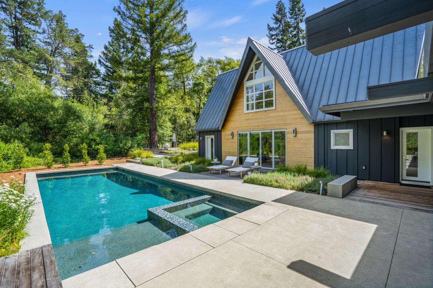 135 Willowbrook Drive Portola Valley, CA 94028 - Photo 5 of 50 a view of house with swimming pool and sitting area