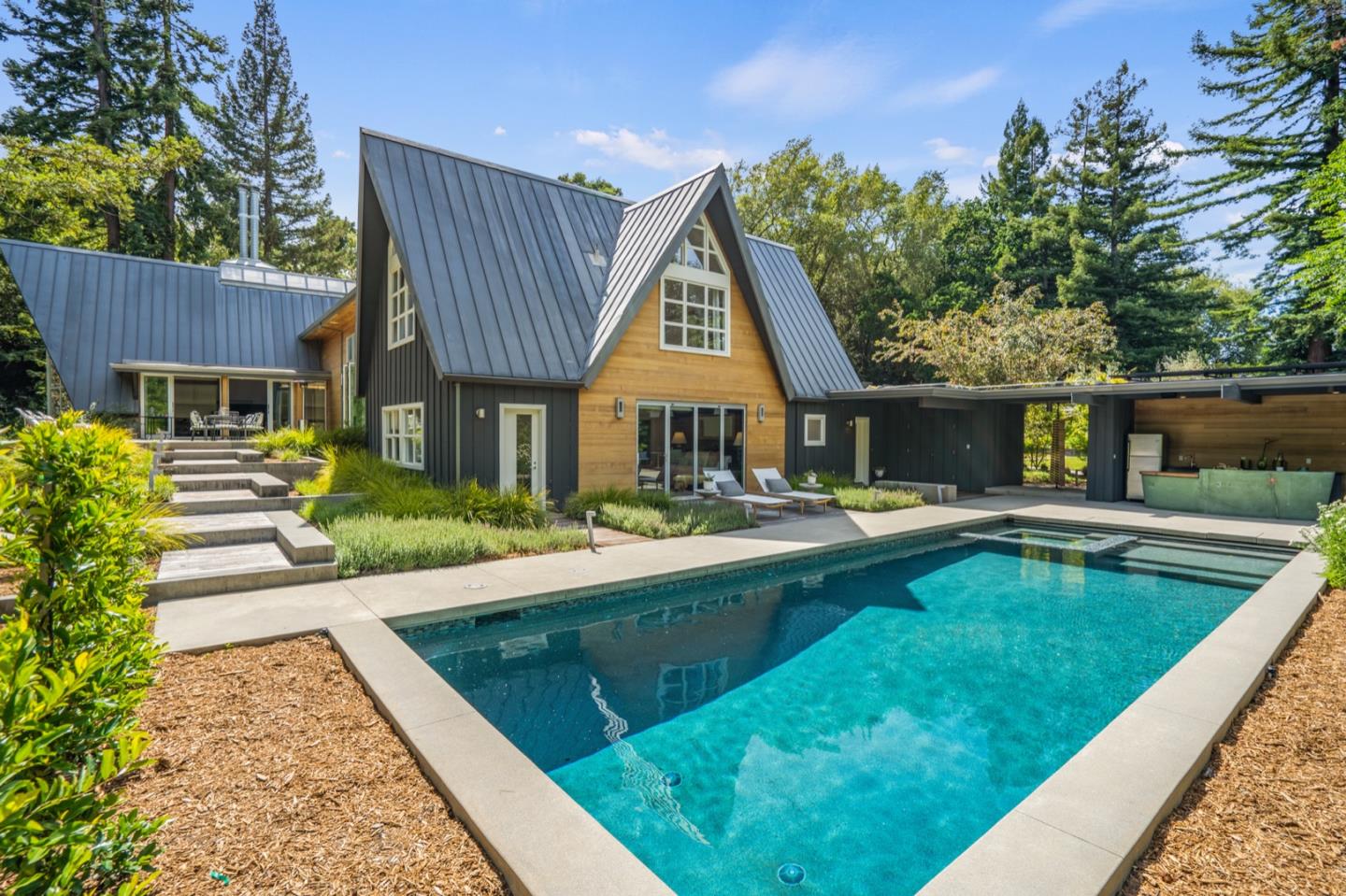 135 Willowbrook Drive Portola Valley, CA 94028 - Photo 6 of 50 a view of swimming pool with lawn chairs and plants