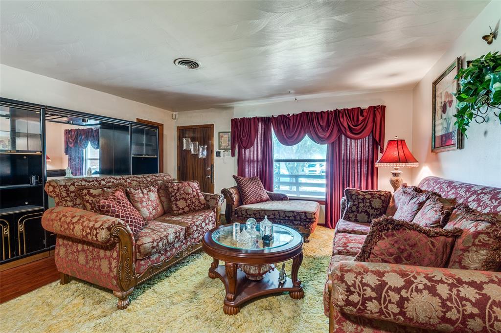 1447 Gillette Street Dallas, TX 75217 - Photo 12 of 12 a living room with furniture and a large window