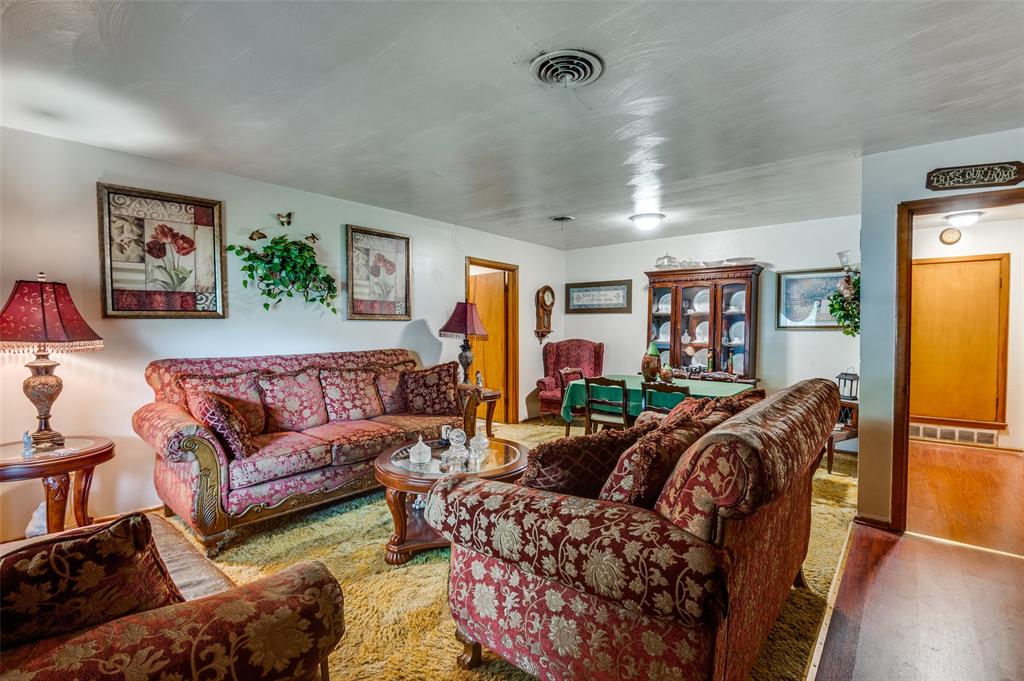 1447 Gillette Street Dallas, TX 75217 - Photo 2 of 12 a living room with furniture and a couch