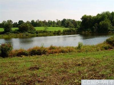 620 Bean River Road Millerton, NY 12546 - Photo 2 of 6 a view of a lake with houses in the back