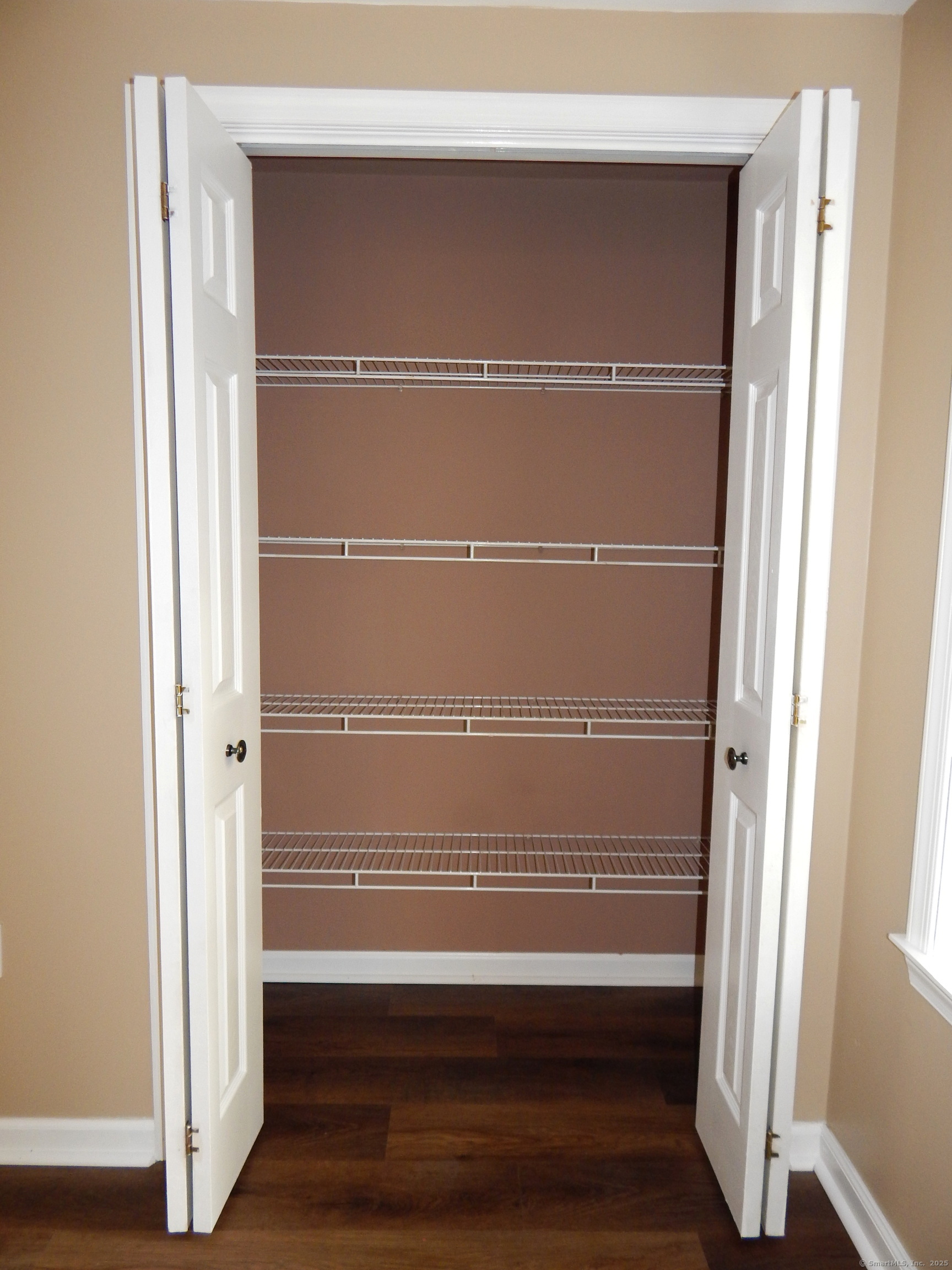 62 Bascom Road Lebanon, CT 06249 - Photo 16 of 34 a view of walk in closet with empty racks