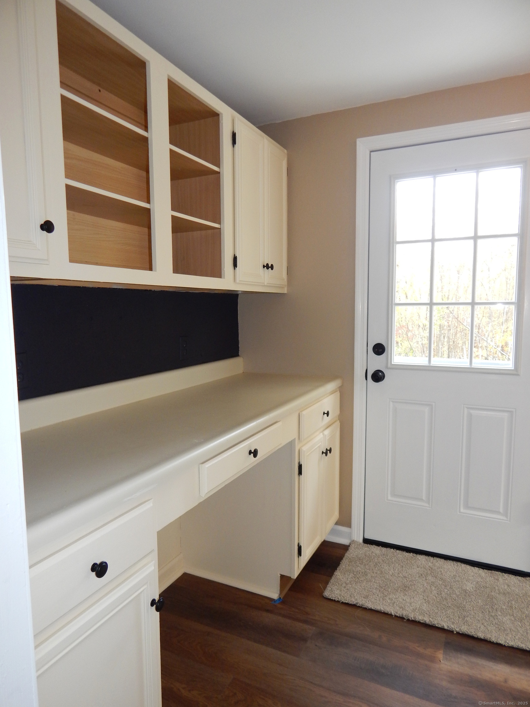 62 Bascom Road Lebanon, CT 06249 - Photo 18 of 34 a view of an empty room with a window and wooden floor