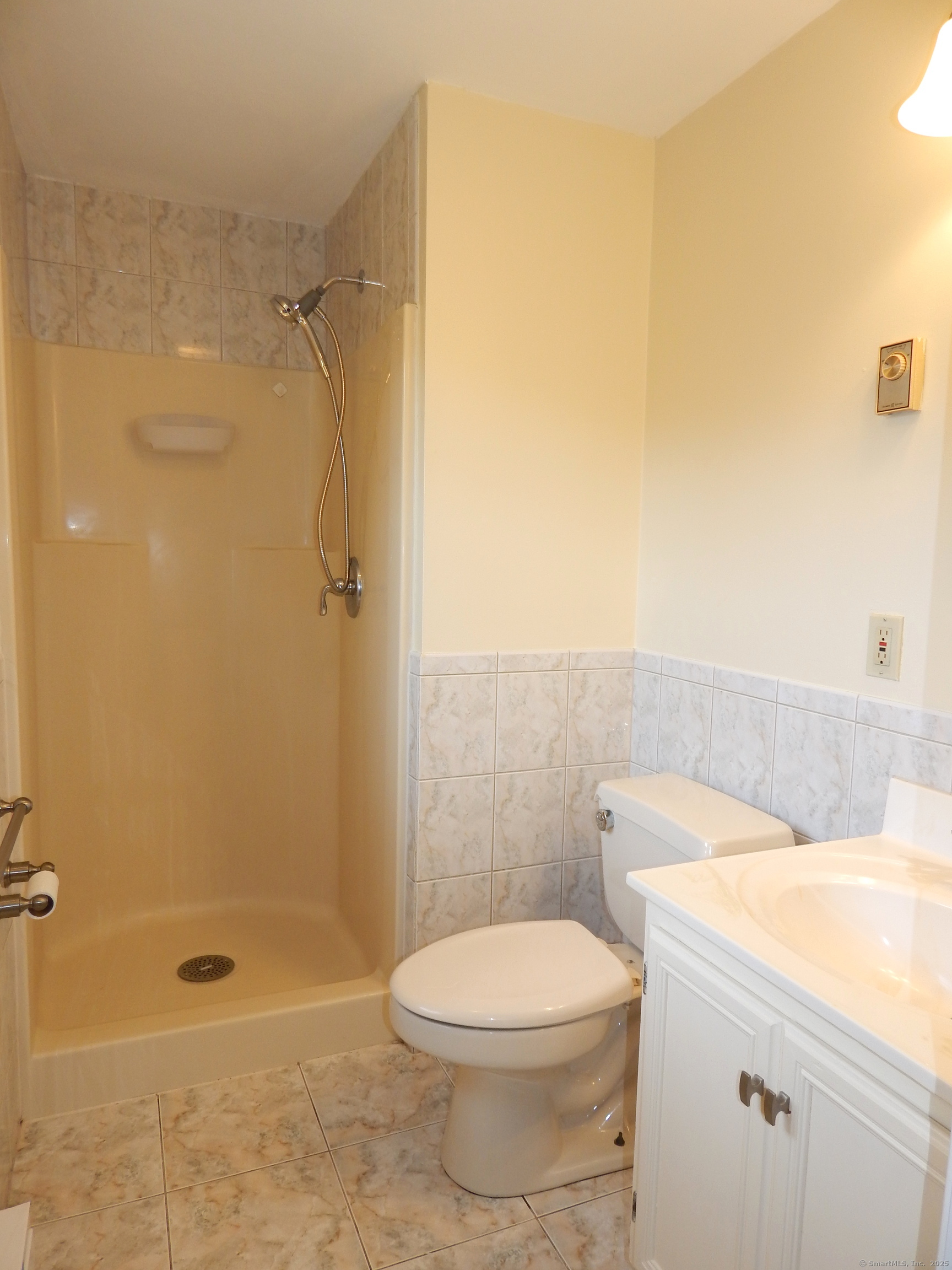 62 Bascom Road Lebanon, CT 06249 - Photo 23 of 34 a bathroom with a shower a toilet and a sink