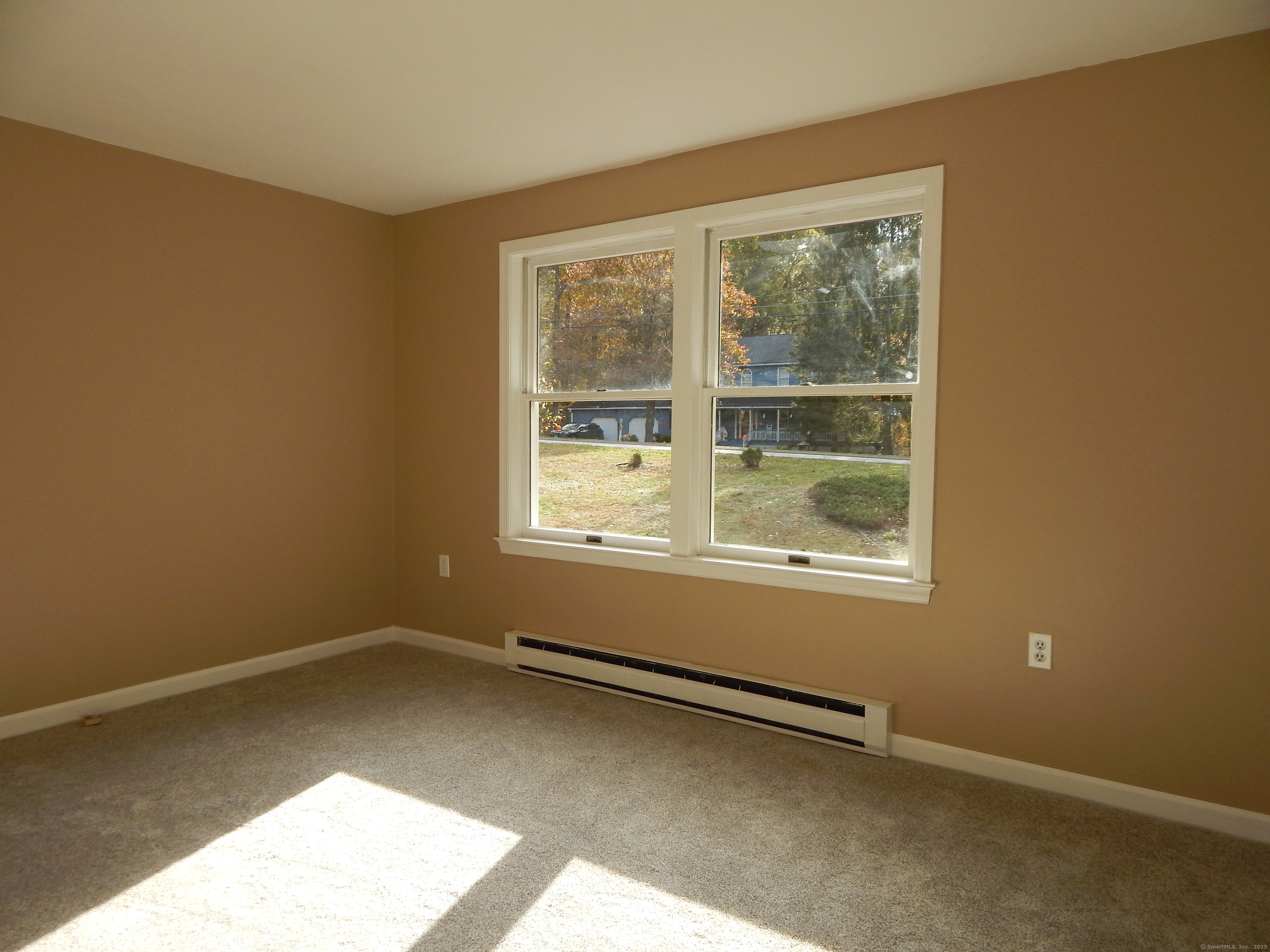 62 Bascom Road Lebanon, CT 06249 - Photo 27 of 34 a view of an empty room with a window