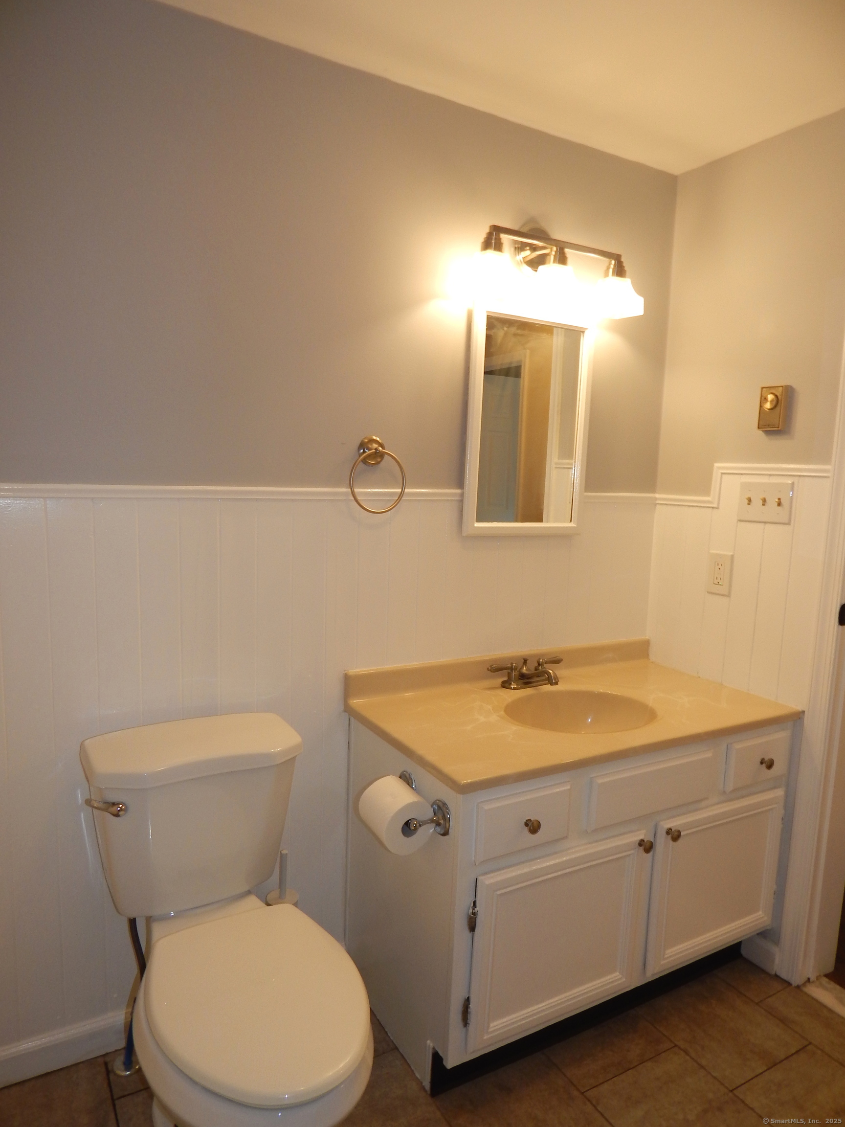 62 Bascom Road Lebanon, CT 06249 - Photo 30 of 34 a bathroom with a granite countertop toilet sink and mirror