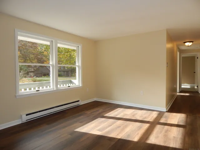 a view of an empty room and a window