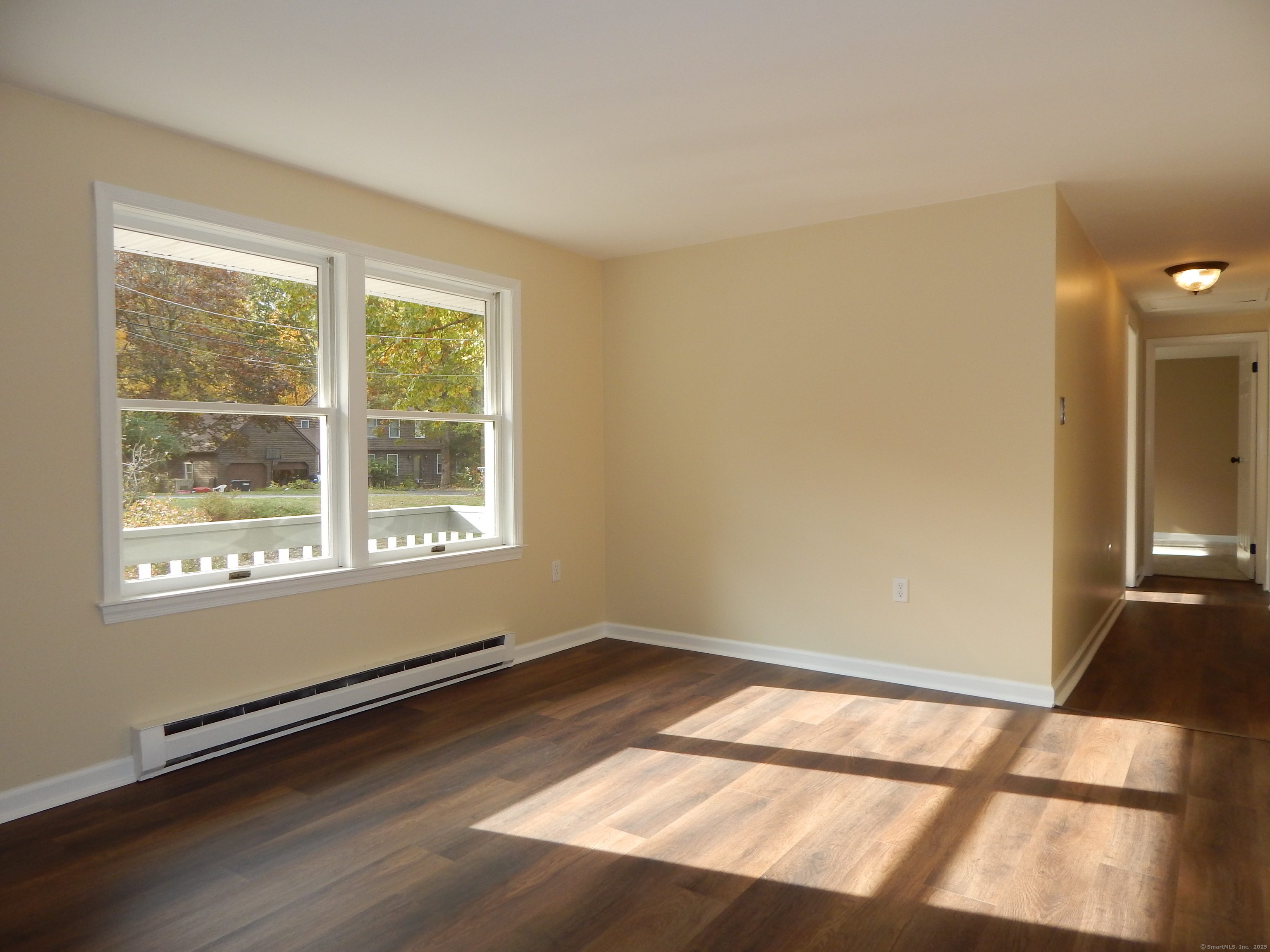 62 Bascom Road Lebanon, CT 06249 - Photo 6 of 34 a view of an empty room and a window