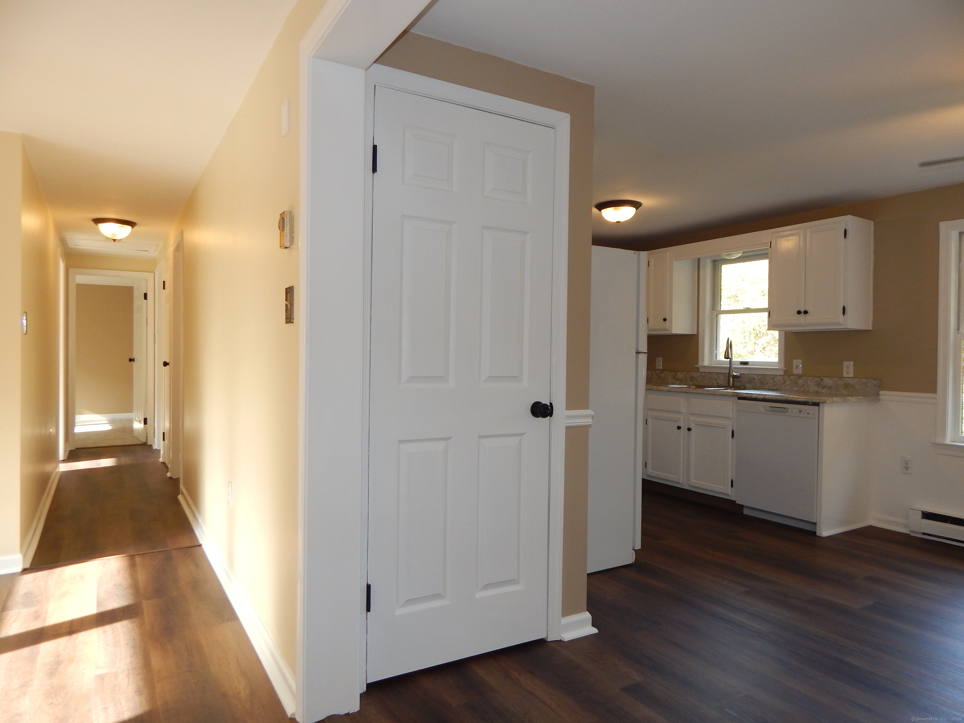 62 Bascom Road Lebanon, CT 06249 - Photo 8 of 34 a view of a hallway with wooden floor and closet