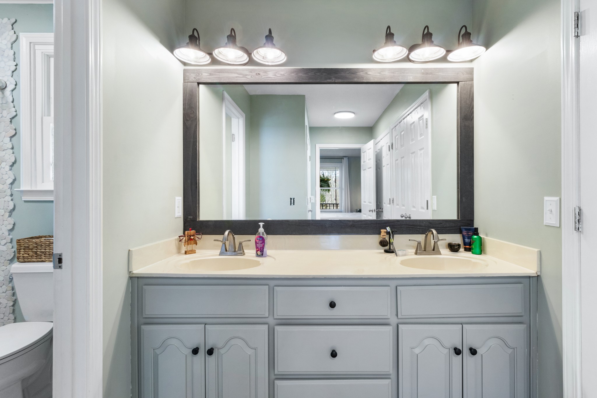 340 Batson Road Cunningham, TN 37052 - Photo 23 of 57 a bathroom with a sink vanity and mirror