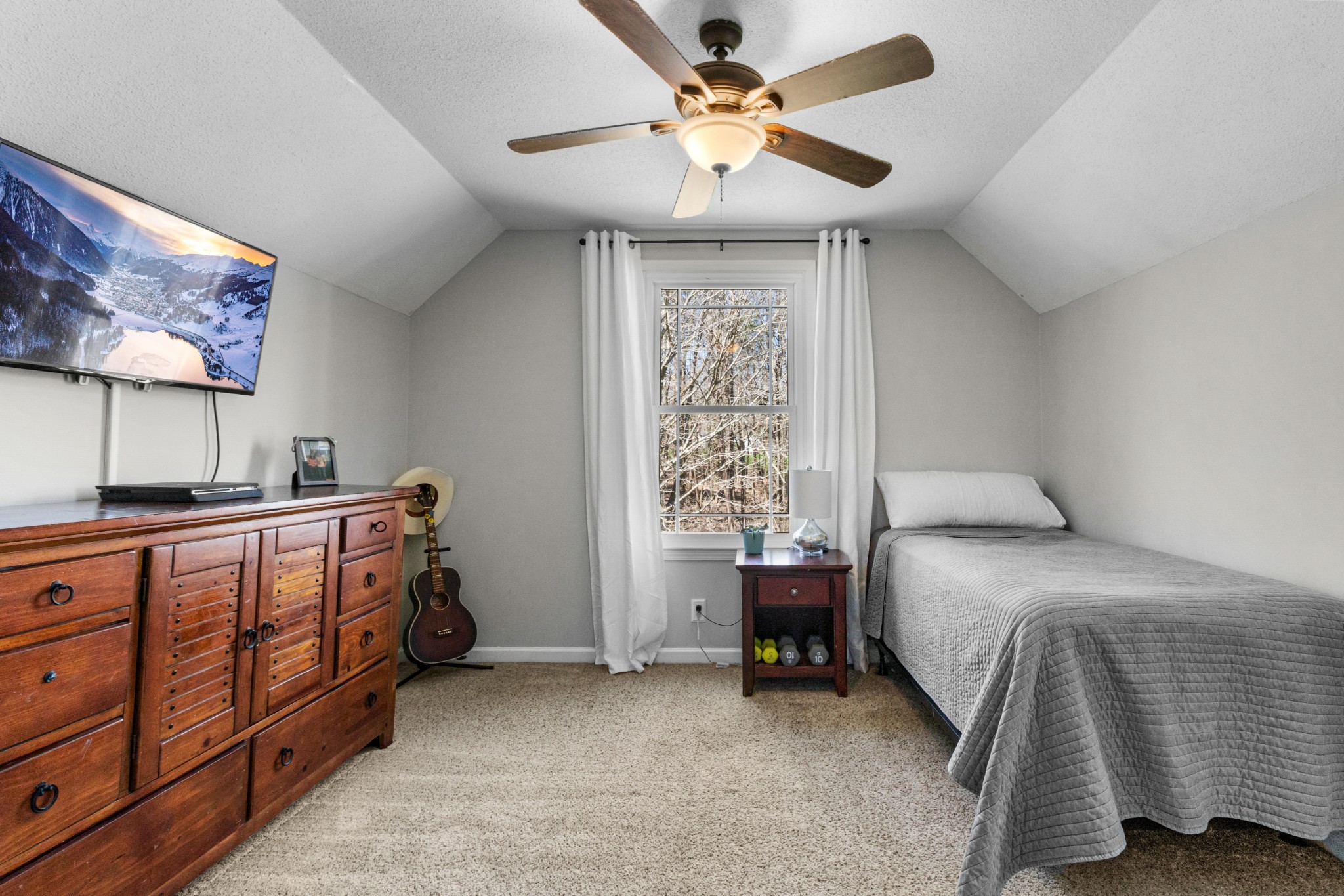 340 Batson Road Cunningham, TN 37052 - Photo 25 of 57 a bedroom with a bed and a chandelier