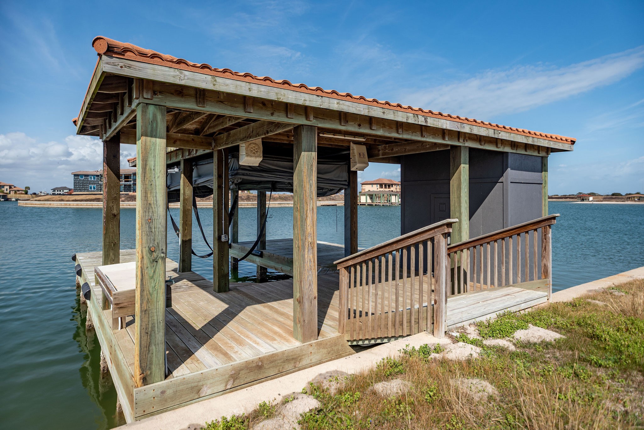 154 Chateau Way Port Port O'Connor, TX 77982 - Photo 2 of 16 Single Stall Boathouse with remote touchless boat cover, fishing deck, storage room, and fish cleaning table