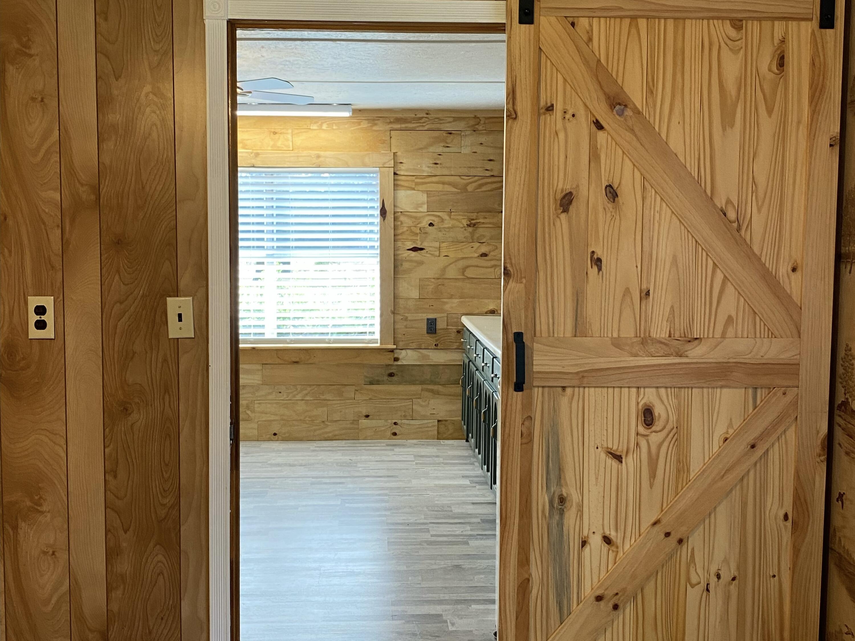 186 McLaughlin Road Milton, FL 32570 - Photo 11 of 26 a view of a bathroom with a door