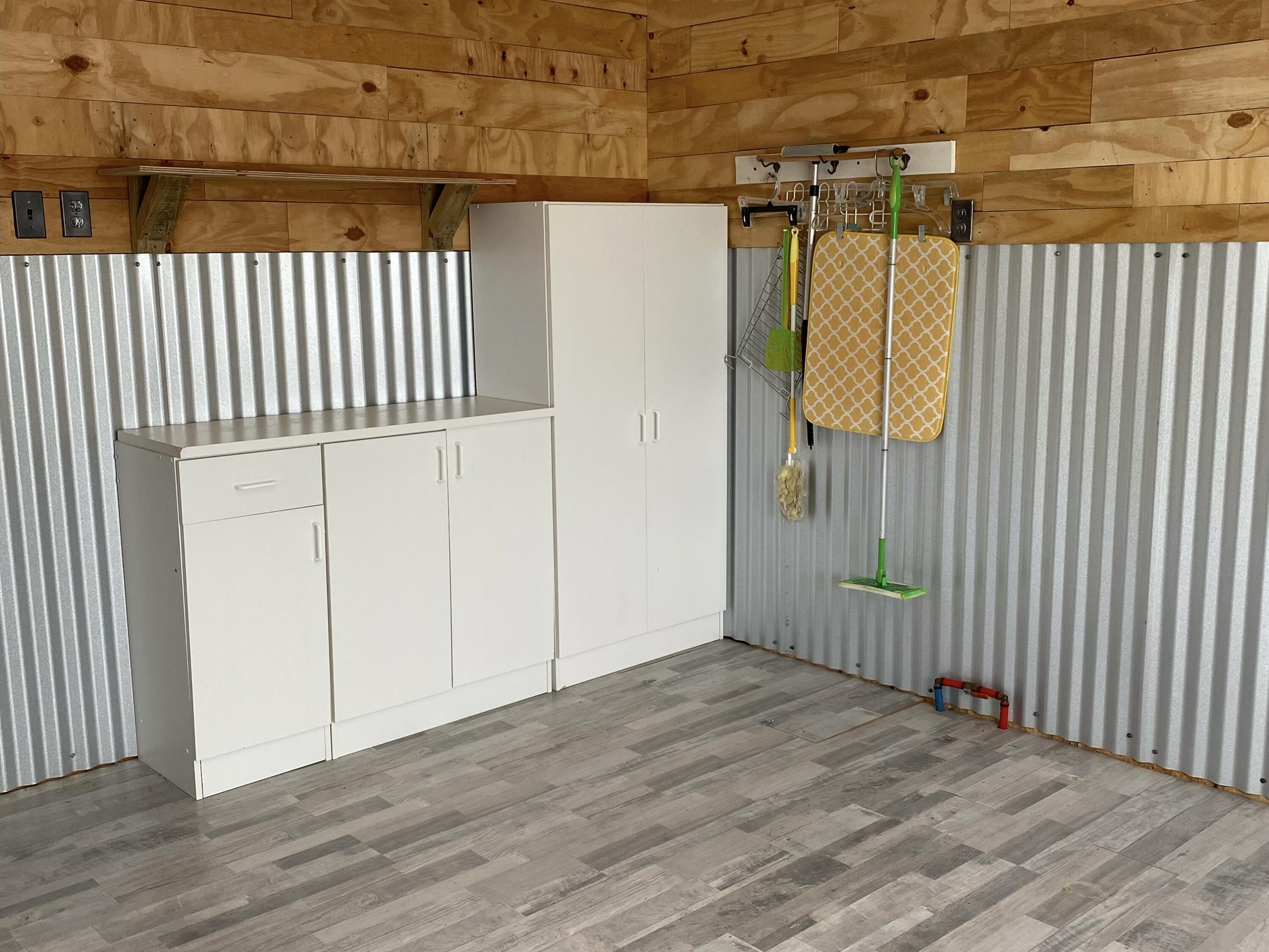 186 McLaughlin Road Milton, FL 32570 - Photo 16 of 26 a view of a bathroom with wooden floor