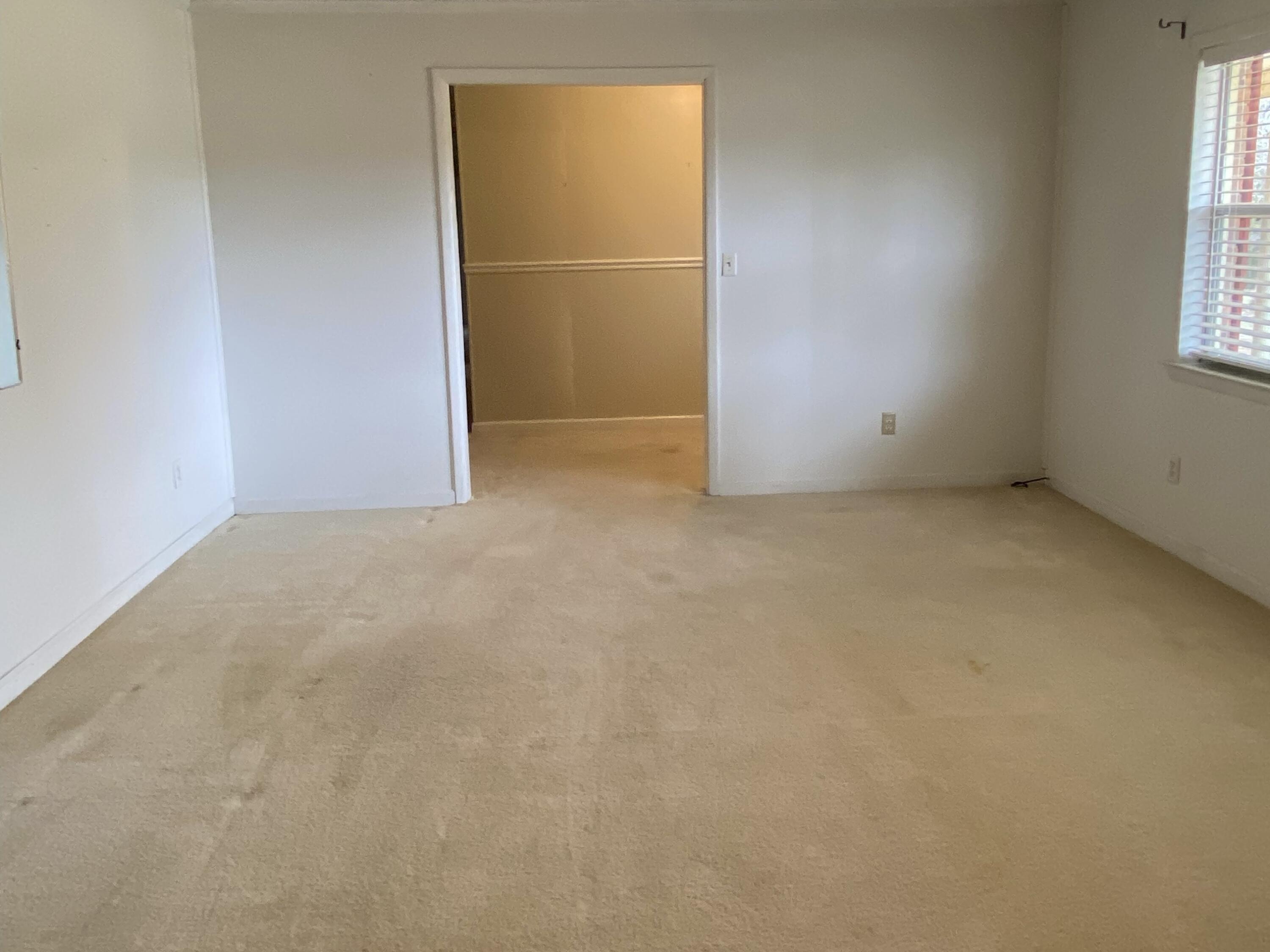186 McLaughlin Road Milton, FL 32570 - Photo 18 of 26 an empty room with windows