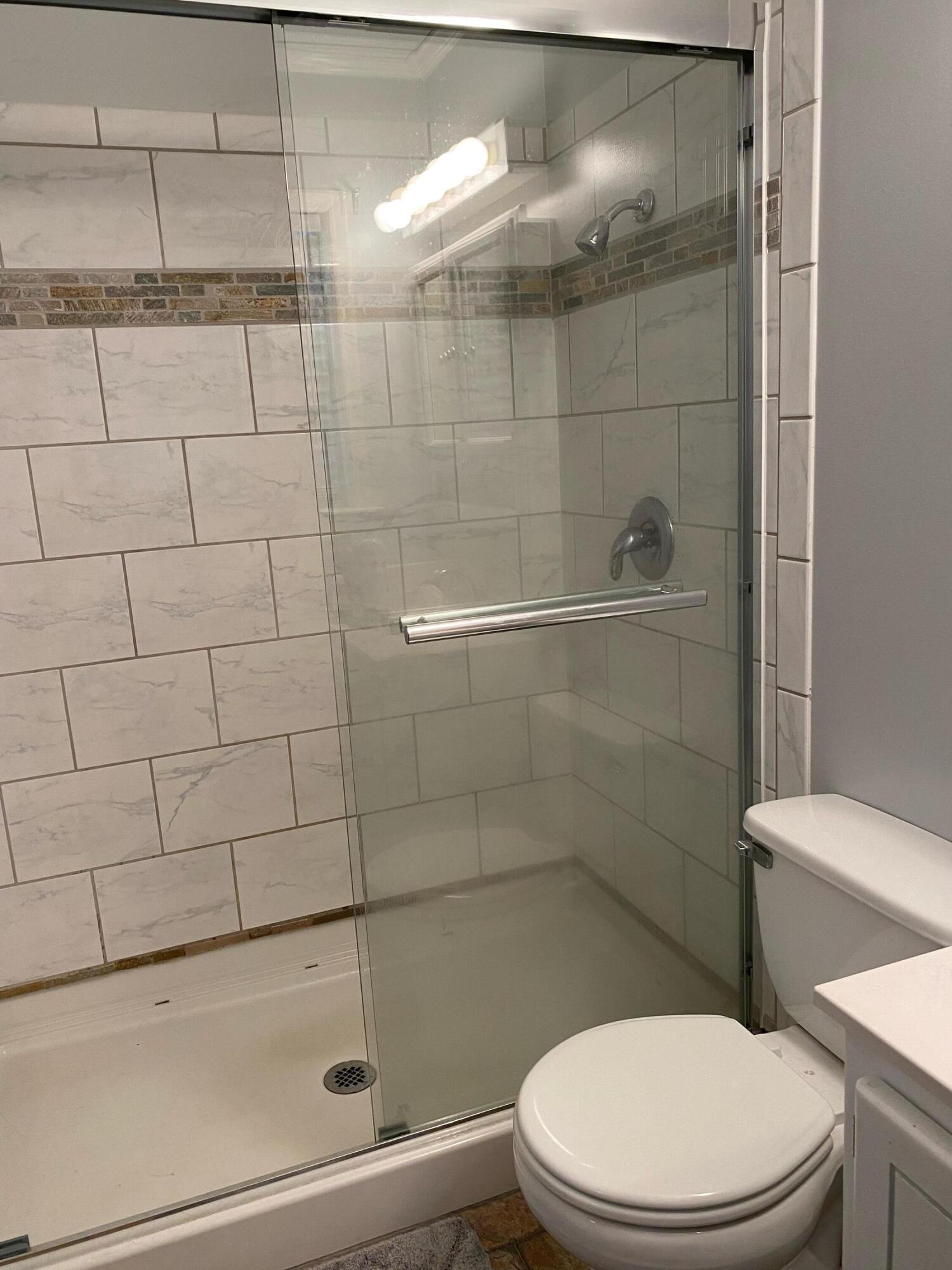 186 McLaughlin Road Milton, FL 32570 - Photo 24 of 26 a white toilet sitting next to a bath tub