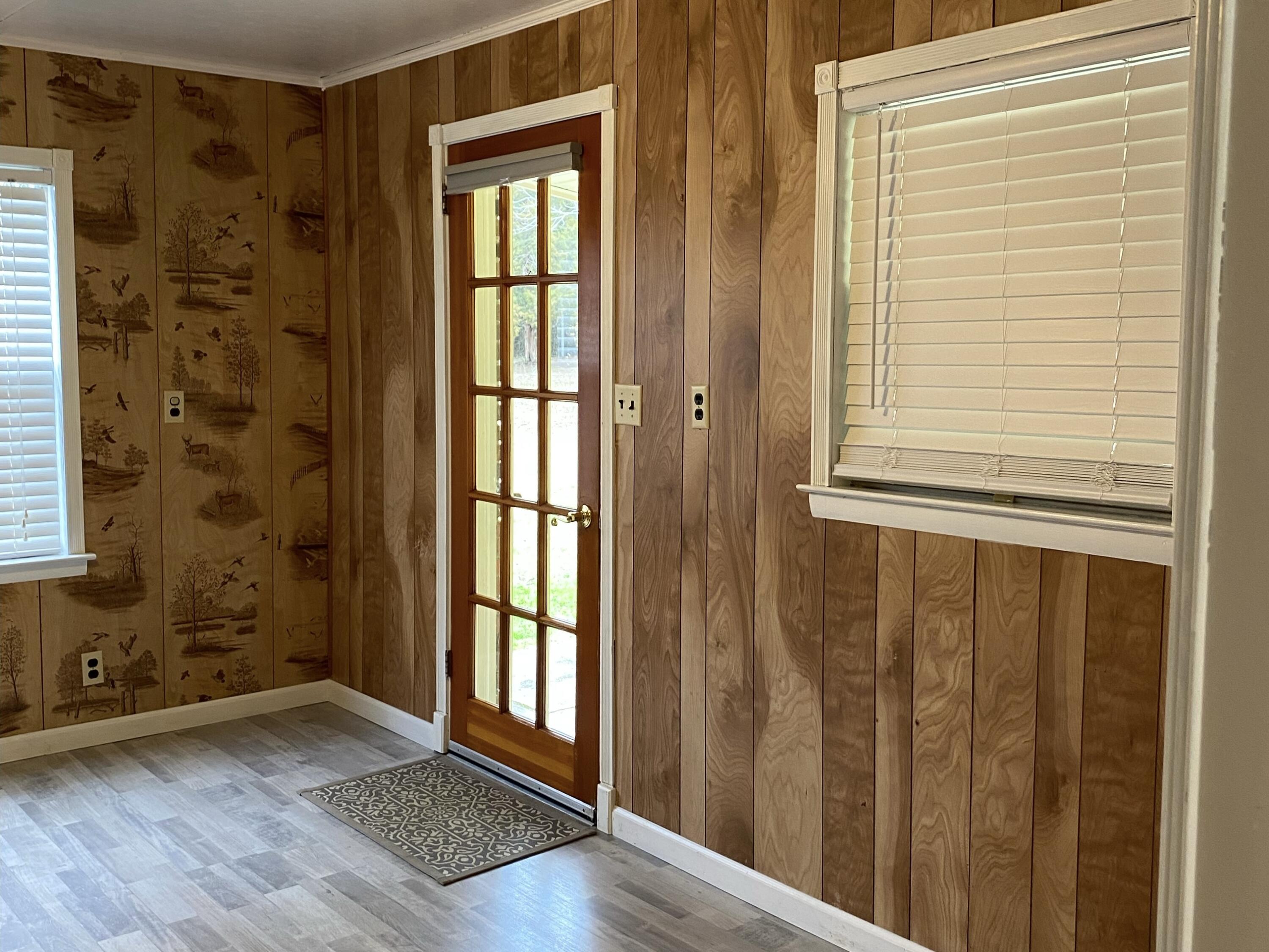 186 McLaughlin Road Milton, FL 32570 - Photo 9 of 26 a view of front door with wooden floor