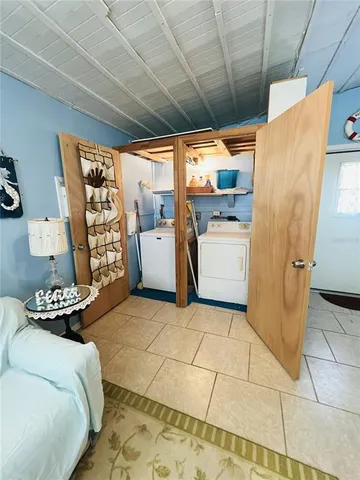 a kitchen with a sink a stove and a refrigerator