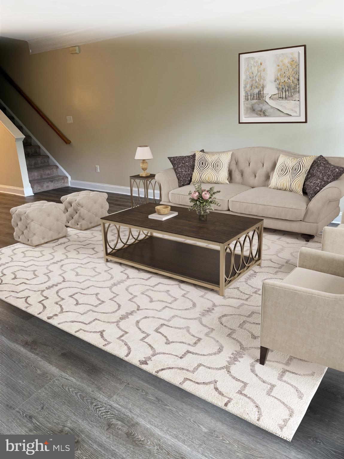 680 Orchard Ridge Drive, Unit 100 Gaithersburg, MD 20878 - Photo 3 of 25 a living room with a couch