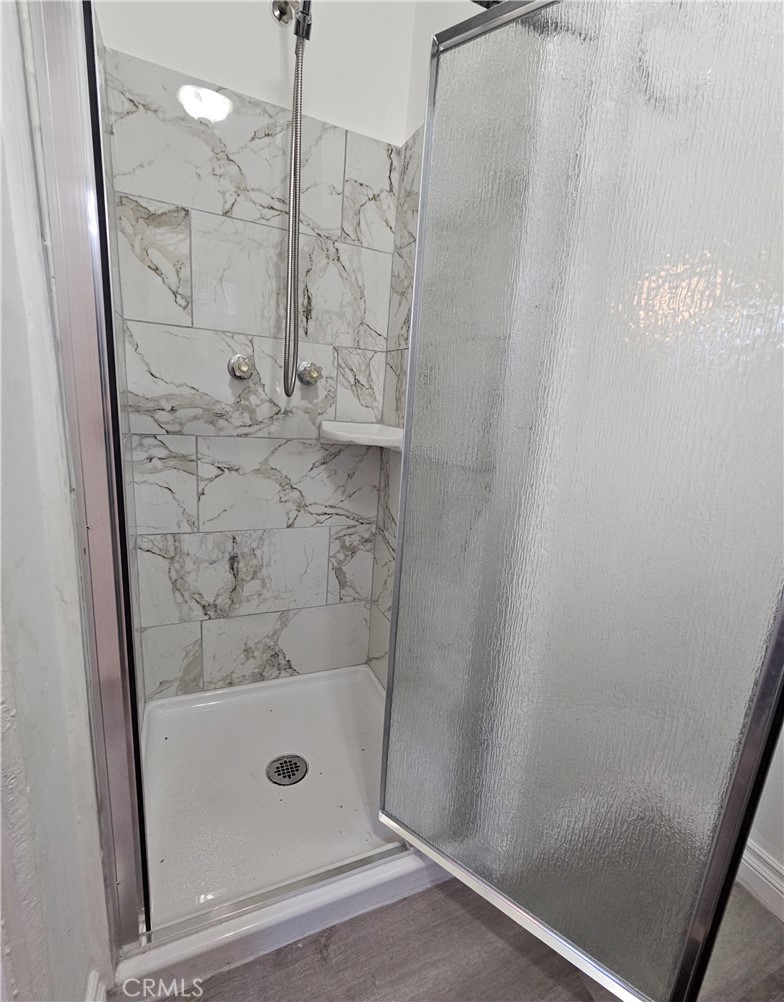 7513 Lurline Avenue Winnetka, CA 91306 - Photo 8 of 9 a bathroom with a shower