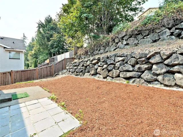 a view of a backyard of the house