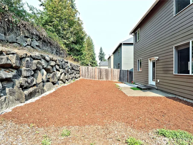 a view of a backyard of the house