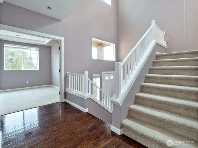 a view of an entryway with wooden floor