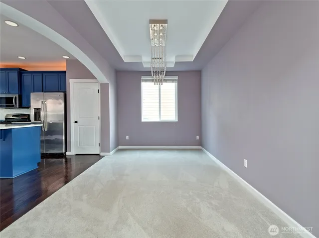 a view of a kitchen with a sink dishwasher and a window