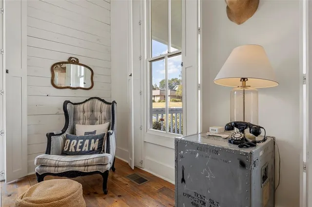 a view of a patio with table and chairs and potted plants