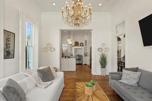 a kitchen with stainless steel appliances a stove oven and a large window
