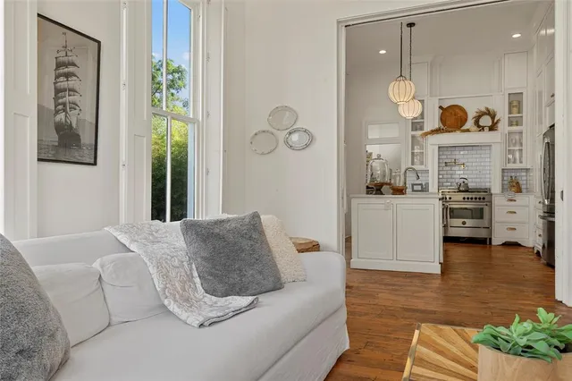 a stove top oven sitting inside of a kitchen