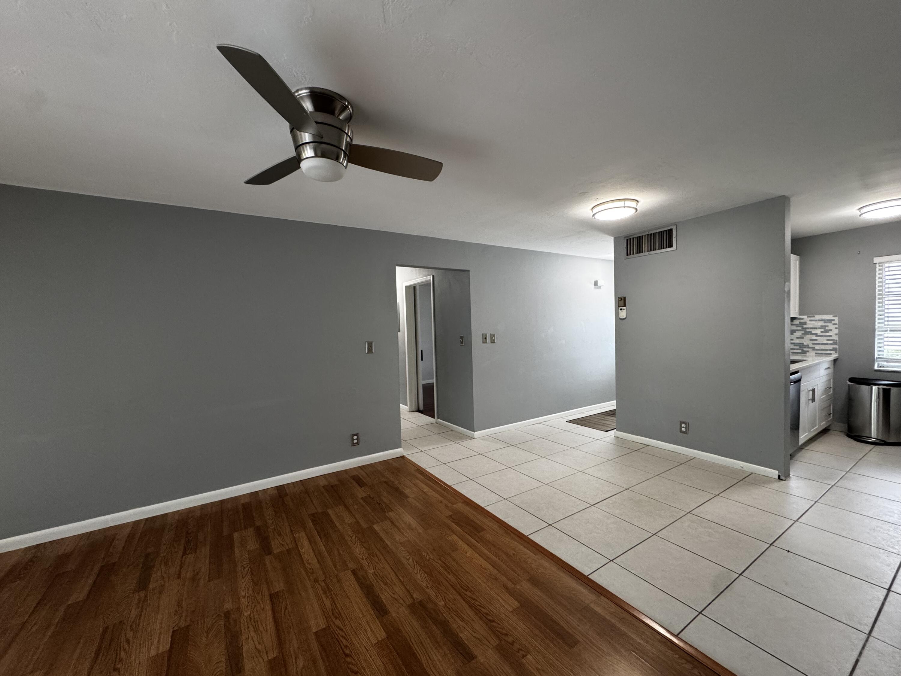 73 East Court, Unit 73 Royal Palm Beach, FL 33411 - Photo 4 of 17 a view of a livingroom with a flesh sink