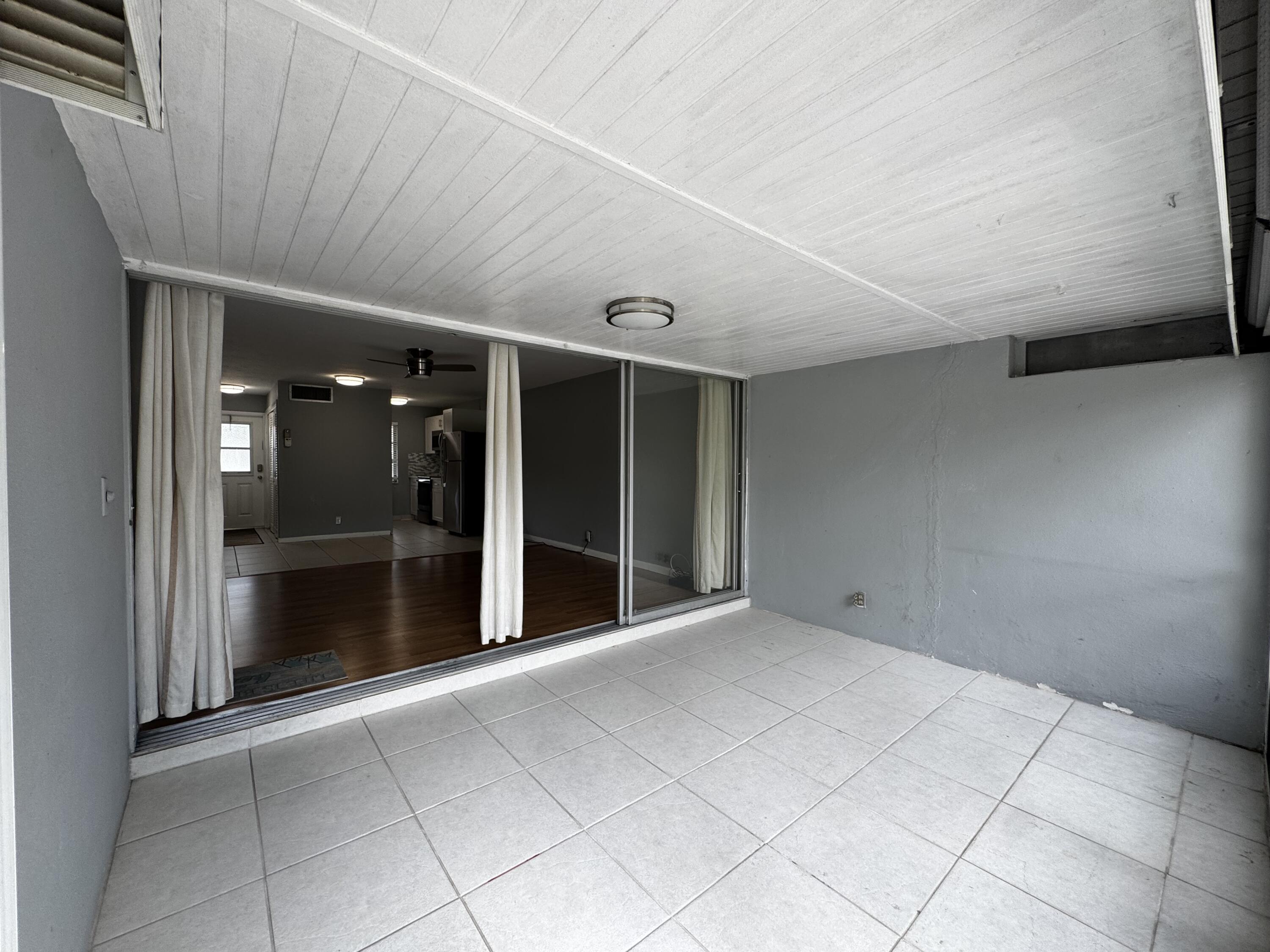 73 East Court, Unit 73 Royal Palm Beach, FL 33411 - Photo 9 of 17 a view of an empty room